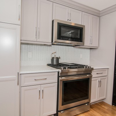 ful kitchen remodel with stove and oven